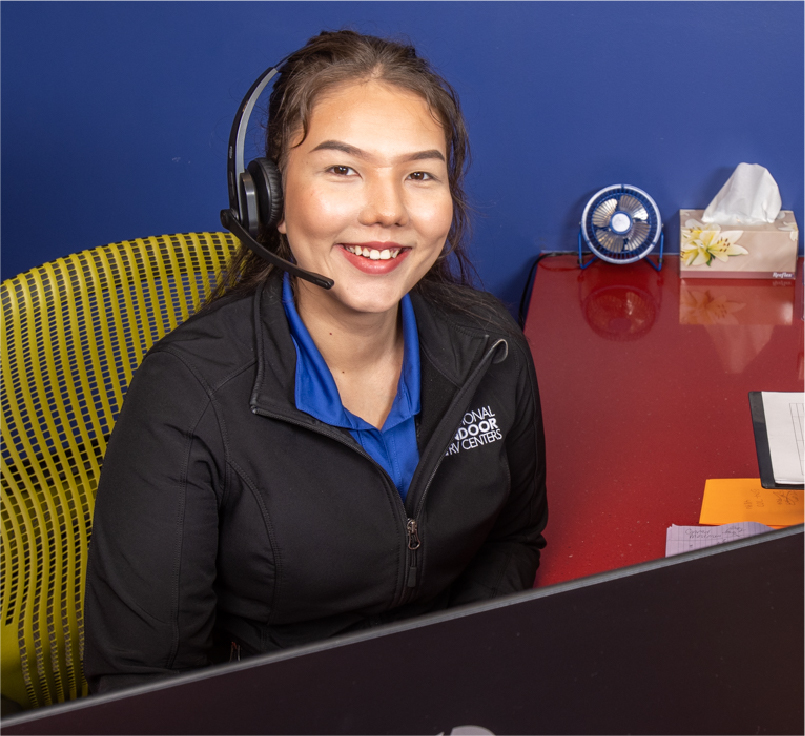 NIRVC Employee in Headset Smiling