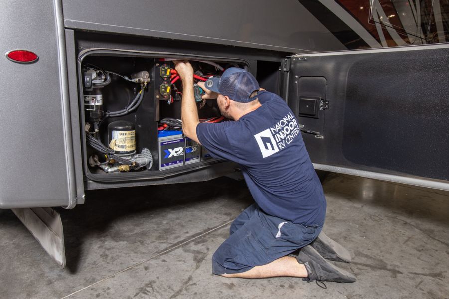 NIRVC Technician Working Outside Motorhome