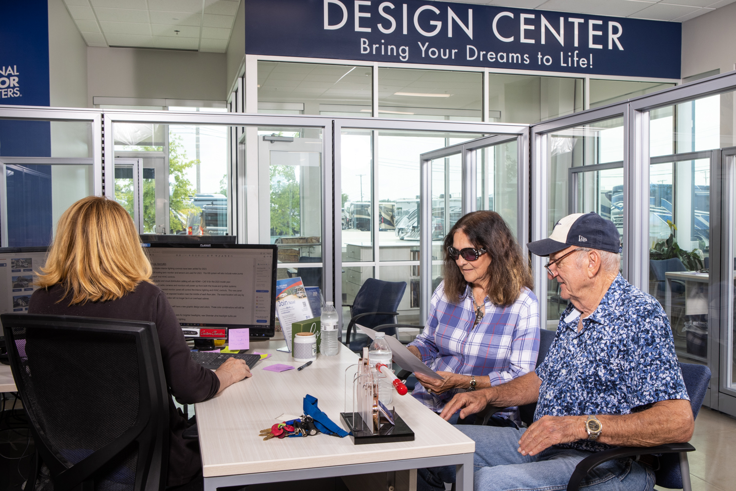 /MarketingAssetPhotos/SellYourRV/Customers_At_Desk_2.jpg