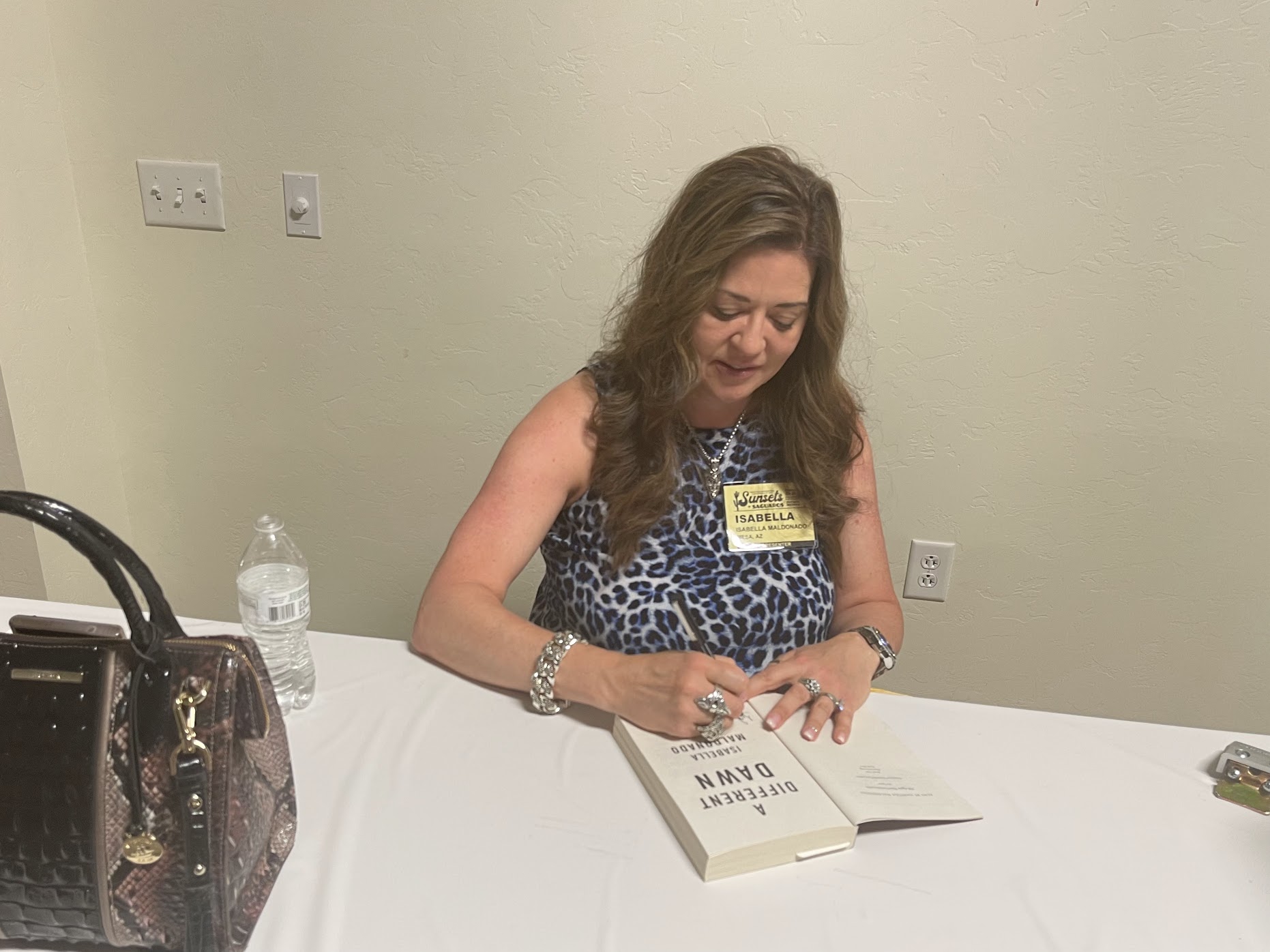 Isabella Madonado signing her book