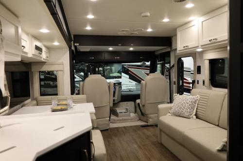 The interior of the 2025 Newmar Bay Star Sport motorhome exudes elegance and comfort, featuring ample seating and a well-appointed living area, perfect for life on the road.