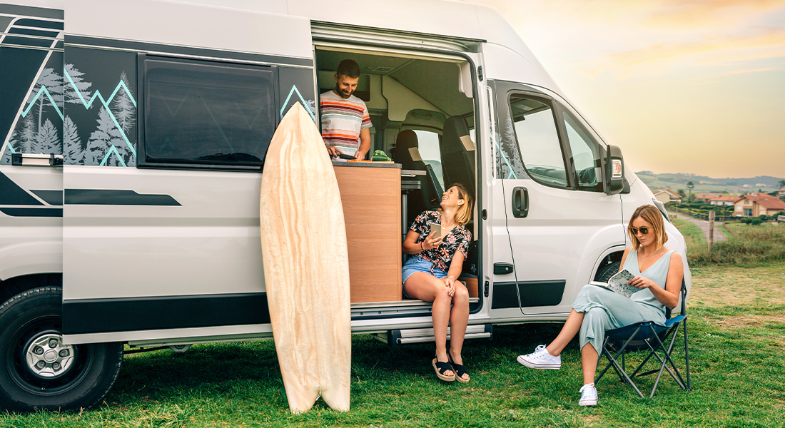 Friends Hanging Out by Sliding Door of Class B Motorhome